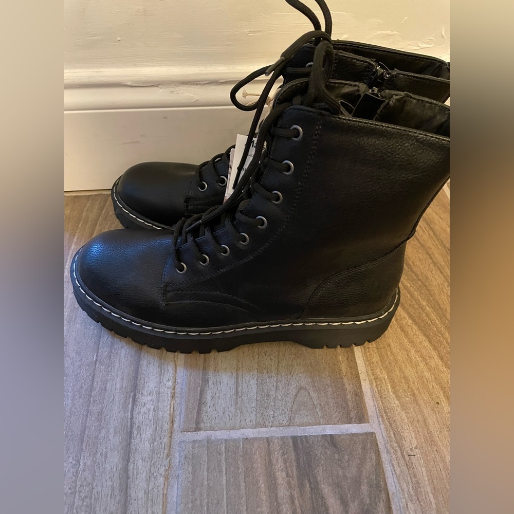 Black combat boots never worn. They are a bit too big for me.